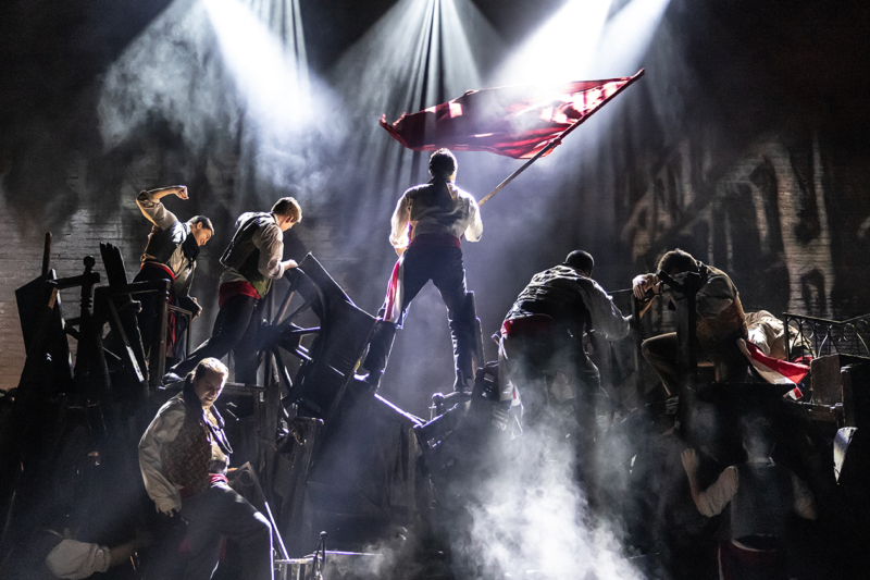 “The Barricade” - Christian Mark Gibbs as Enjolras and company in Les Misérables Photo: Matthew Murphy